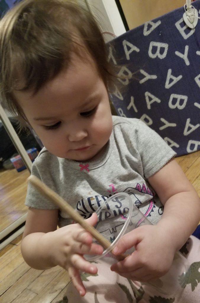Playing with her Harry Potter Wand
